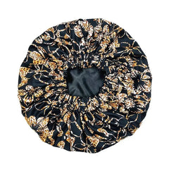 The New African Ankara Pattern Satin Lined Bonnet is a stylish, big-sized hair cover for women, featuring a double-layer design and long ribbon headwrap to protect hair in style.