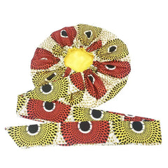 The New African Ankara Pattern Satin Lined Bonnet is a big size double-layer headscarf with a long ribbon, featuring bold red, yellow, and black geometric circular designs. Stylish protection as a women’s beanie or headwrap.