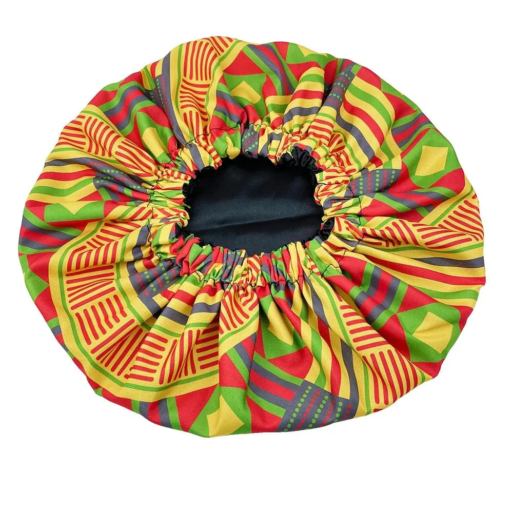 The New African Ankara Pattern Satin Lined Bonnet features a vibrant geometric design, black inner lining, and elastic opening, perfect as a multifunctional women’s beanie or headwrap with double layer protection for adult hair.