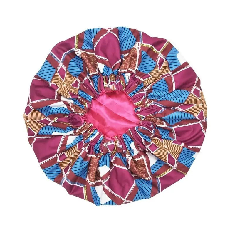 The New African Ankara Pattern Satin Lined Bonnet features a colorful geometric design, long ribbons, and double-layer protection—serving as a stylish headwrap, multifunction skull cap, or women's beanie.