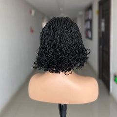 A short, black kinky twist braided wig on a mannequin head.