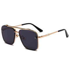 Square-framed sunglasses with a gold metal double-bridge design and dark lenses.