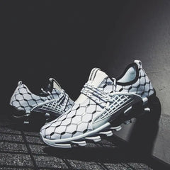 The New Fashion Men Running Shoes feature a modern mesh design with a white base and black geometric hexagon pattern, displayed on a textured surface with dramatic lighting.