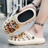A pair of beige slip-on clogs featuring a colorful Chinese lion dance pattern.