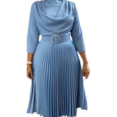 A light blue midi dress with a cowl neckline, three-quarter sleeves, and a pleated skirt.