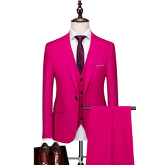 A slim-fit magenta three-piece suit with a single-breasted jacket, vest, and matching trousers.