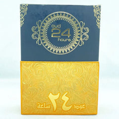 A rectangular perfume box with a dark blue top and a textured gold bottom featuring Arabic text.