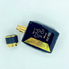 A black rectangular bottle of Oud 24 Hours perfume with a gold cap and label.