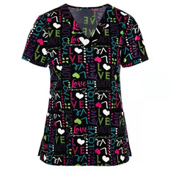 Black V-neck scrub top featuring a colorful pattern of hearts and the word love.