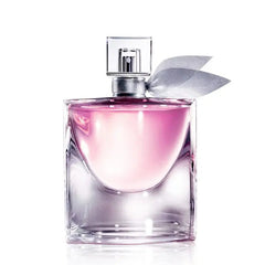 A square glass perfume bottle with pink liquid and a silver ribbon tied around the neck.