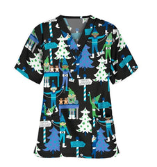 Black V-neck scrub top featuring a festive Santa's workshop print with elves and Christmas trees.