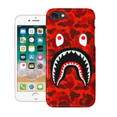 A red camouflage iPhone case featuring a prominent shark mouth graphic.