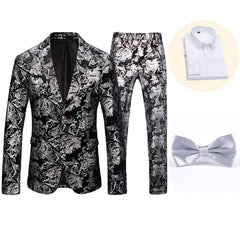 A black and silver floral print suit set including a blazer, trousers, white shirt, and bow tie.