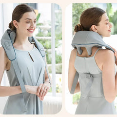 A woman wears a grey, wearable neck and shoulder massager with adjustable straps.