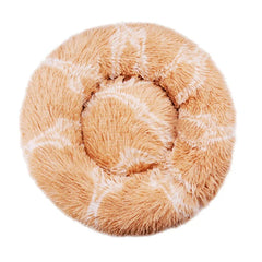 A round, plush pet bed in a solid tan color with a soft, shaggy texture.