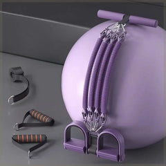 A purple pedal resistance band set with elastic cords, handles, and a yoga ball.