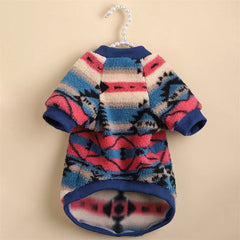 A cozy, fleece-lined dog sweater featuring a colorful, retro-inspired geometric print.