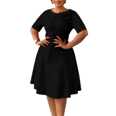 A black knee-length A-line dress with short sleeves, an O-neck, and 3D flower button detailing.