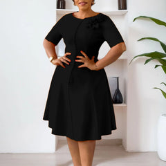 A black knee-length A-line dress with short sleeves, an O-neck, and 3D flower button detailing.