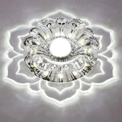 A modern LED ceiling light featuring a crystal flower design with a glowing acrylic petal border.