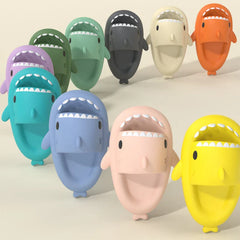 A collection of colorful shark-shaped EVA slides arranged on a light background.