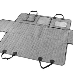 A grey quilted waterproof dog car seat cover with mesh and clear windows and adjustable straps.