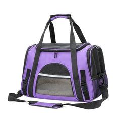 A purple soft-sided pet carrier bag with black mesh windows and a shoulder strap.