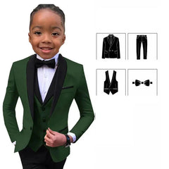 A boy wears a dark green slim-fit suit with a black shawl lapel, vest, trousers, and bowtie.