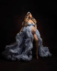Elegant deep V-neck tulle maternity dress with lace hollow details, long sleeves, and feather accents, perfect for photoshoots.