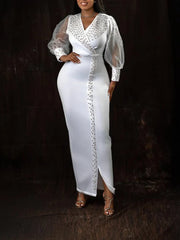 A white ankle-length sheath dress with a V-neck, beaded trim, and sheer lantern sleeves.
