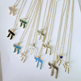 A collection of gold-tone Hebrew Chai pendant necklaces featuring various colors and textures.
