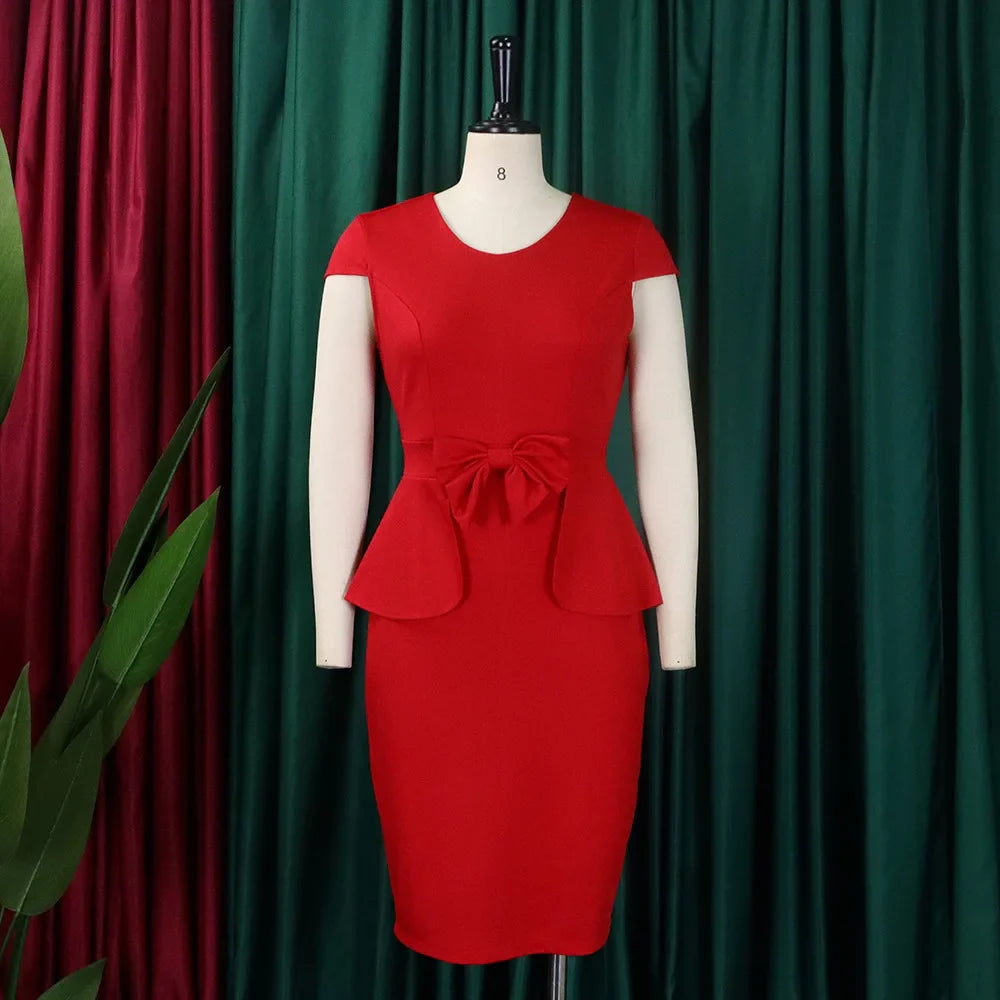 A red knee-length sheath dress with short sleeves, a round neckline, and a bow at the waist.