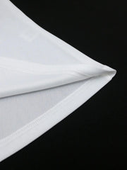 A close-up view of the hem of a white dress showing the fabric texture and stitching detail.