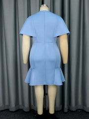 A blue mini dress with a round neck, short cape sleeves, and a ruffled hem on a mannequin.