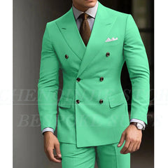 A man wears a bright green double-breasted slim-fit suit with a brown tie and white pocket square.
