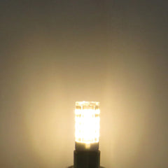 A glowing G9 LED corn bulb emitting a warm light against a plain background.