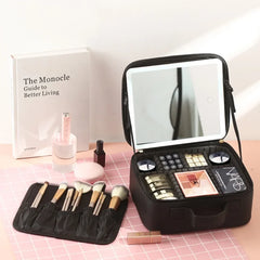 A black portable makeup train case with an integrated LED mirror and organized storage compartments.