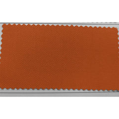 A rectangular swatch of burnt orange fabric with a visible diagonal twill weave.