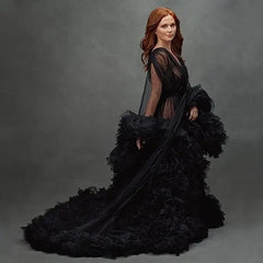 Deep V-neck tulle maternity dress with lace hollow details, long sleeves, feather accents, perfect for photo shoots and special occasions.