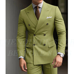 A man wears a slim-fit, double-breasted olive green suit with a brown tie and white pocket square.