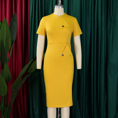 A yellow knee-length sheath dress with short sleeves, a high collar, and triangular button details.