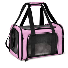 A pink soft-sided pet carrier with black mesh windows and carrying handles.