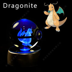 A glowing blue crystal ball featuring a 3D laser-etched Dragonite figure on a lighted base.