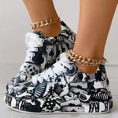 Women's thick-soled sneakers featuring a black and white graffiti print with playing card motifs.