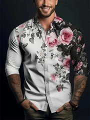 A man wears a long-sleeved button-down shirt featuring a white and black floral rose print.