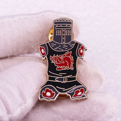 A black enamel lapel pin shaped like a knight in armor featuring a red boar emblem on the chest.