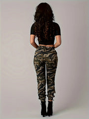 A woman wears low-waisted camo print cargo pants with ankle-length straight legs.