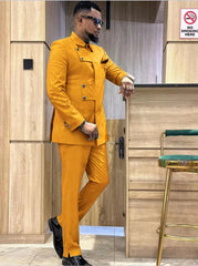 A man wearing a mustard yellow slim-fit suit with a unique asymmetrical button-down jacket.