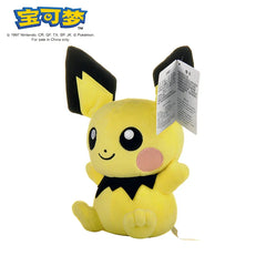 A yellow Pikachu plush toy with black ear tips and a black collar sits against a white background.