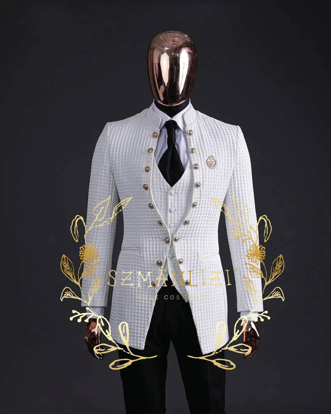 A white floral jacquard three-piece suit with a stand collar and gold buttons on a mannequin.